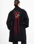 OSCAR MENDOZA Long wool coat, large embroidered heart on the back