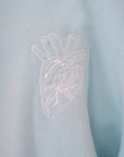 OSCAR MENDOZA sky blue crew neck sweater with embroidered heart