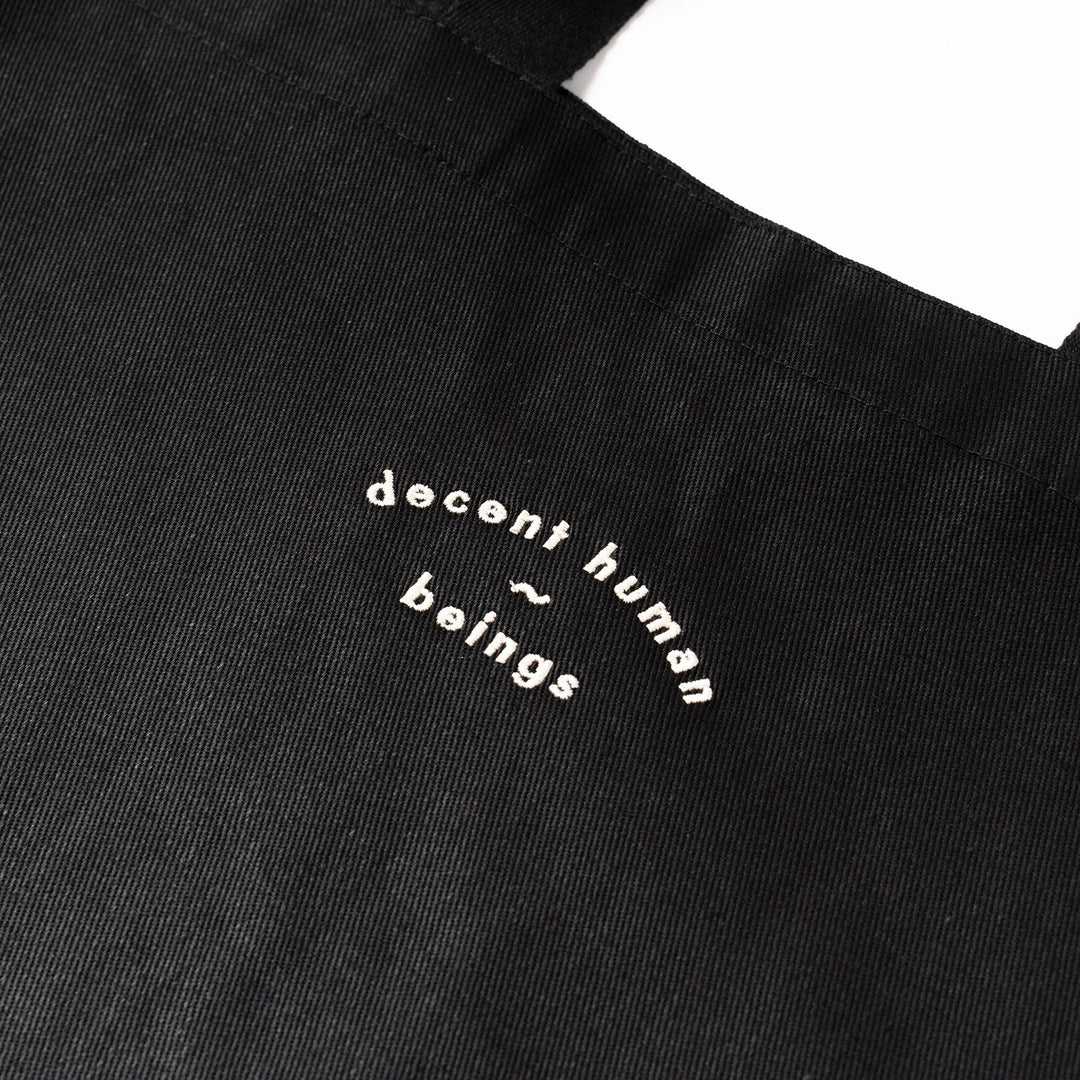 DECENT HUMAN-BEINGS DHB tote bag in black 